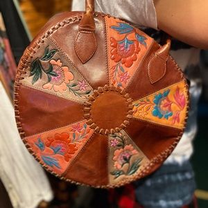 Absolutely beautiful tooled leather bag.14 inch circle